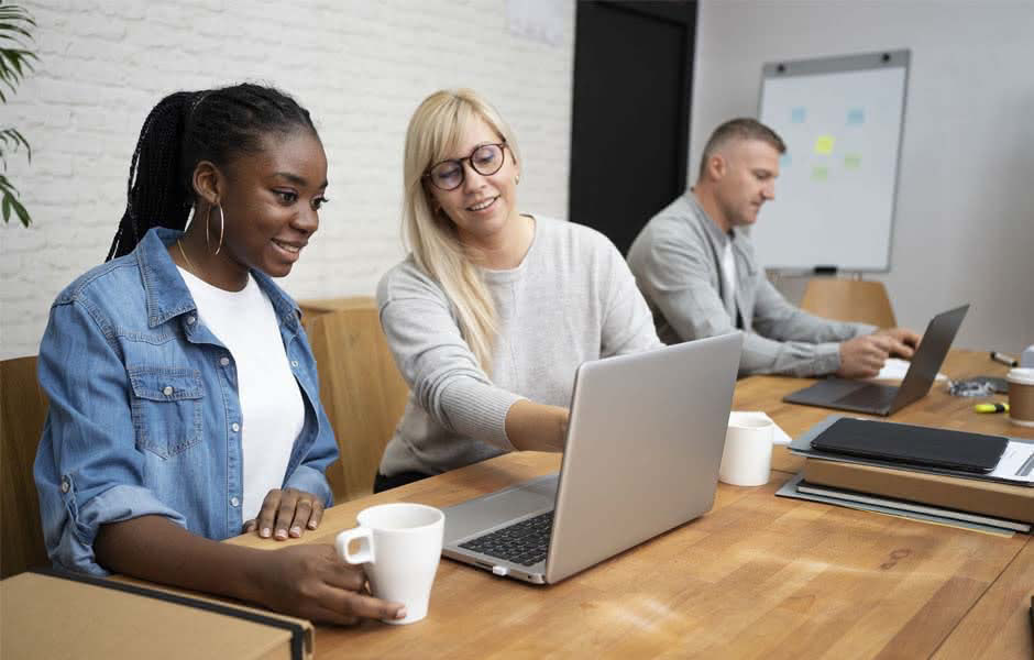 Business People Working on Laptops